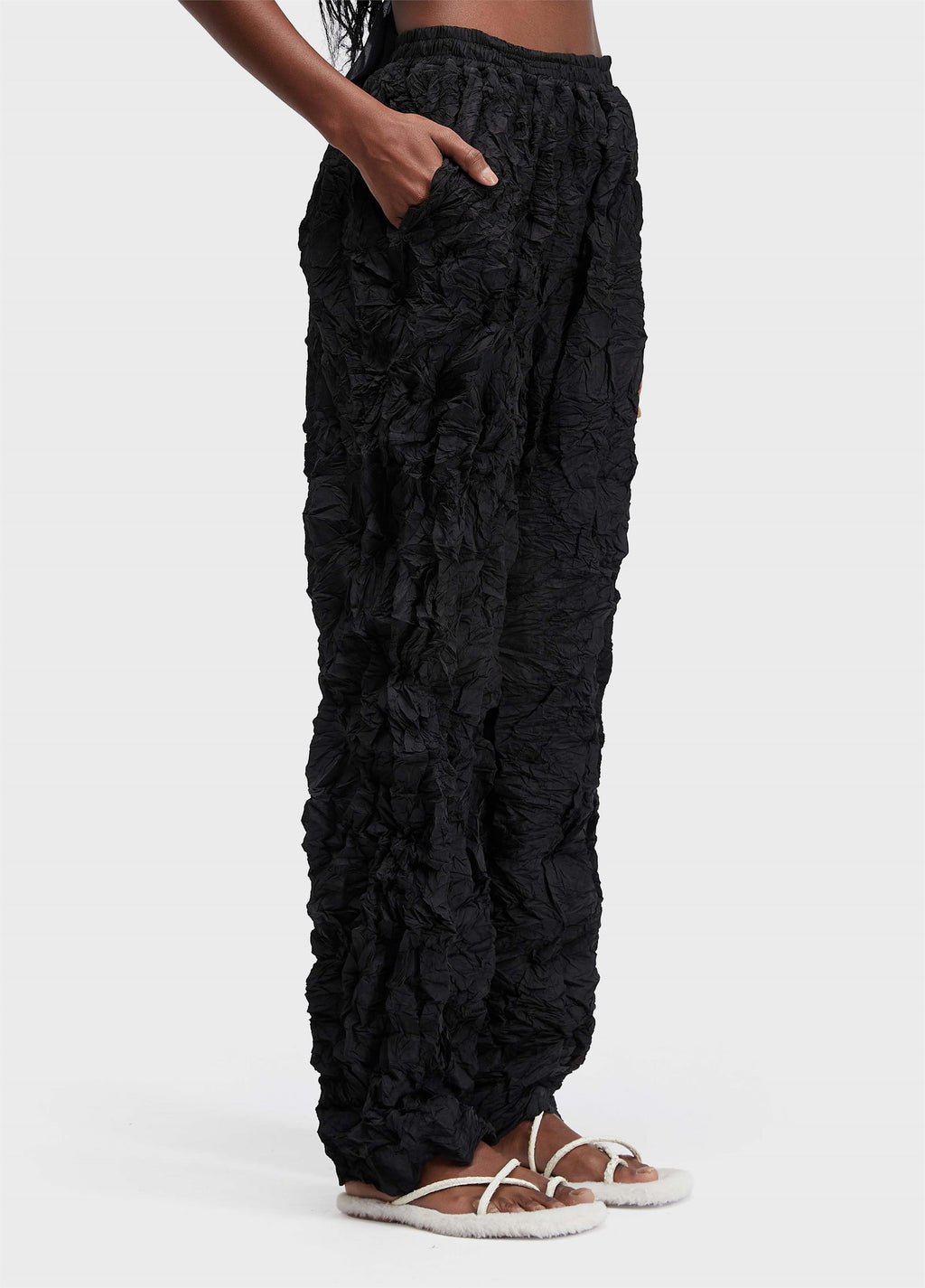 PLEATED TEXTURED TROUSERS